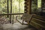A porch swing to relax, unwind and listen to the nearby stream